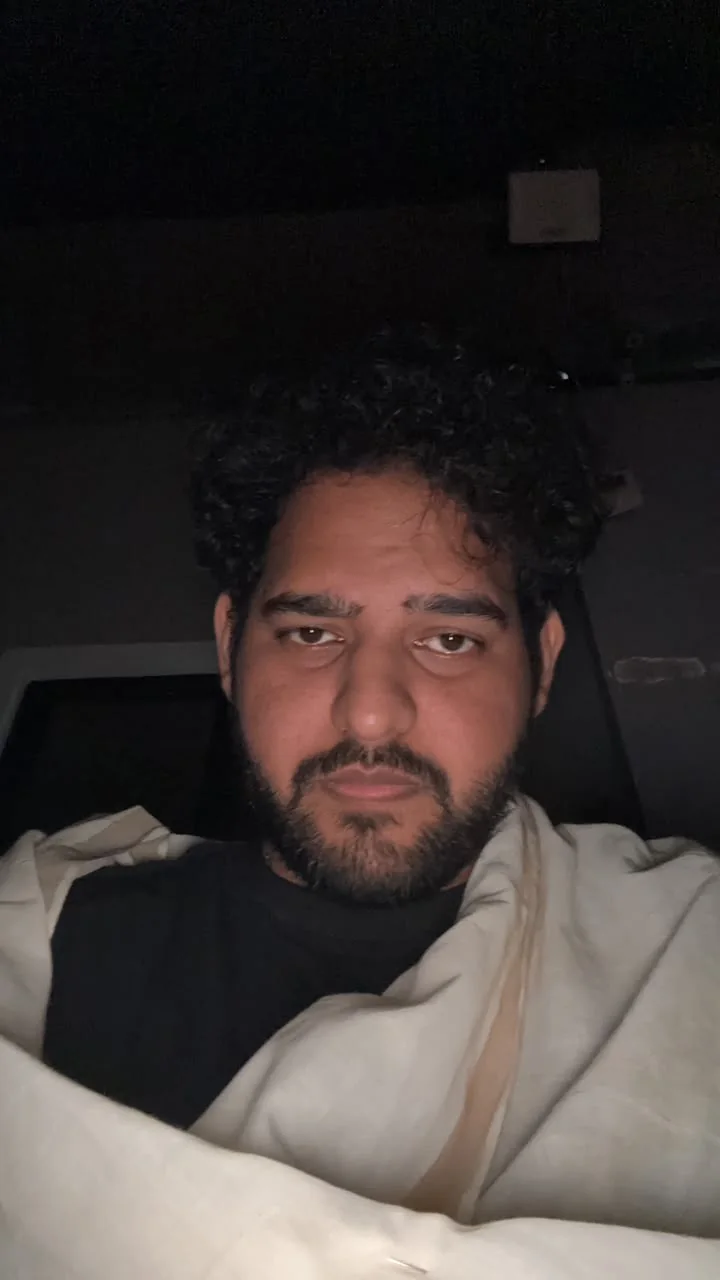 Alii Khan in a candid vertical photograph
