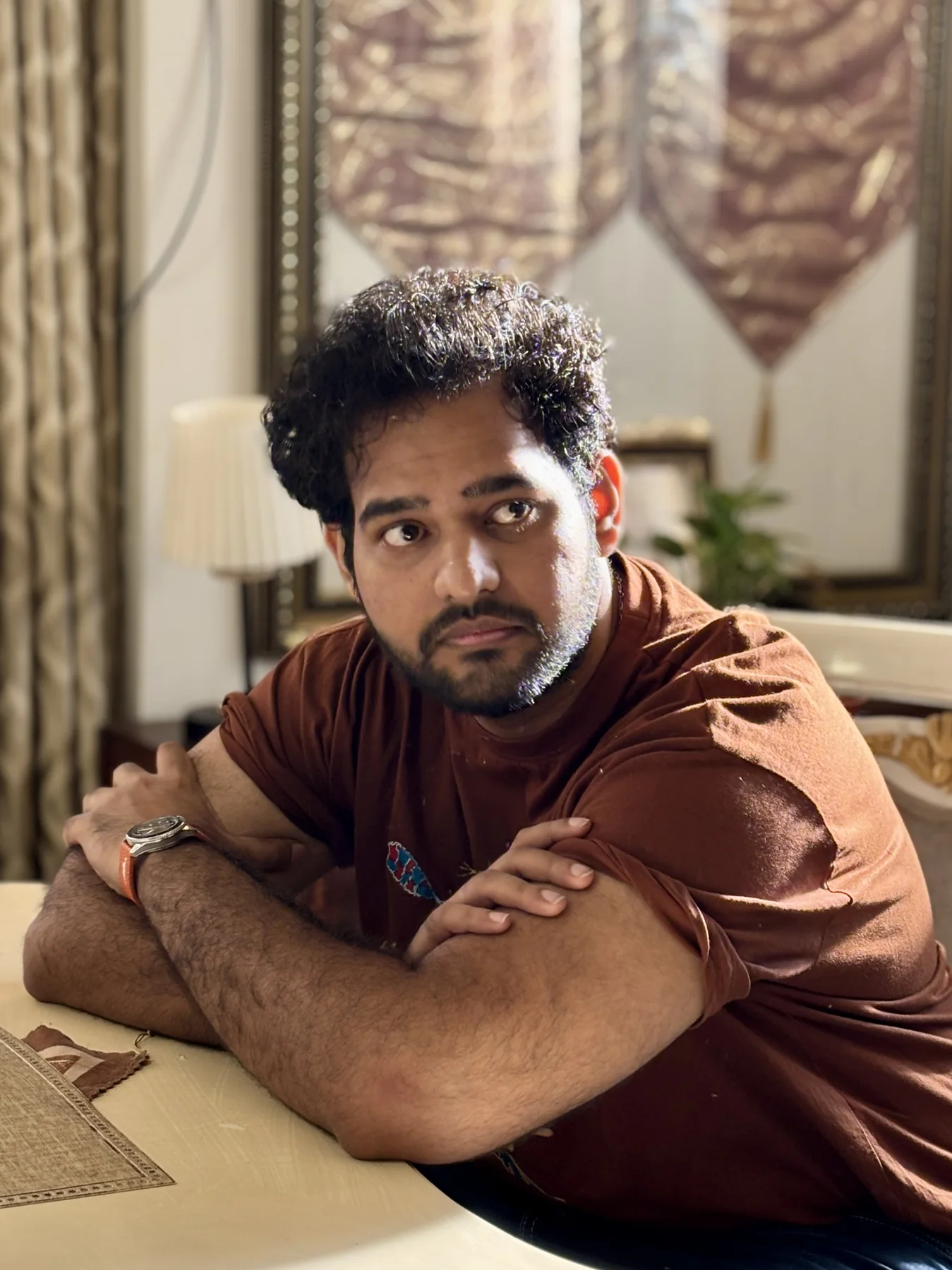 Alii Khan in a warm-toned close portrait